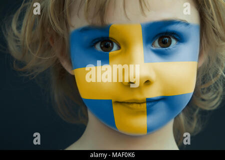 Portrait of a child with a painted Sweden flag Stock Photo