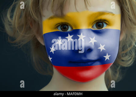 Portrait of a child with a painted Venezuelan flag Stock Photo
