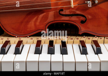 violin on the piano black and white keyboard background Stock Photo