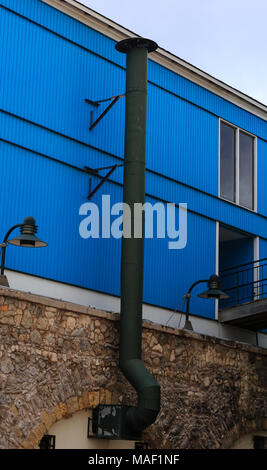 A Black Metal Exhaust Pipe on an Old Building in Curacao Stock Photo