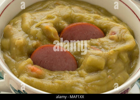 Traditional bowl with Dutch pea soup and smoked sausage close up Stock Photo