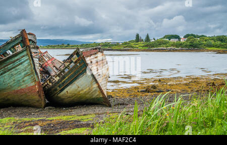 Abandoned and ruined boats along Isle of Mull coastline. Stock Photo