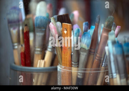Different painting brushes in paiter's atelier. Close-up. Stock Photo