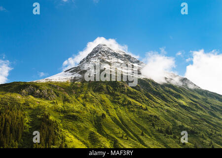 View of the snowy Gorfenspitze peak in summer in Galtur, Paznaun Valley, Austria. Stock Photo