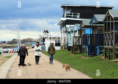 Whitstable, Kent / England - March 31 2018: Women walking their dogs along the Whitstable seafront on a cloudy Easter Bank Holiday weekend Stock Photo