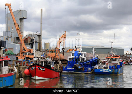 Whitstable, Kent / England - March 31 2018: Whitstable Harbour on a cloudy Easter Bank Holiday weekend Stock Photo