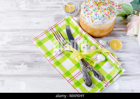 Easter table setting with spring flowers and cutlery. Holidays background Stock Photo