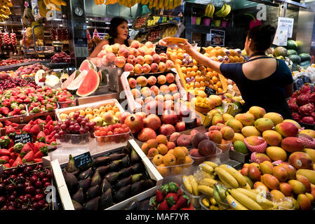 A large selection of fresh fruits on sale in La Boqueria indoor market near La Rambla,, Barcelona, Spain Stock Photo