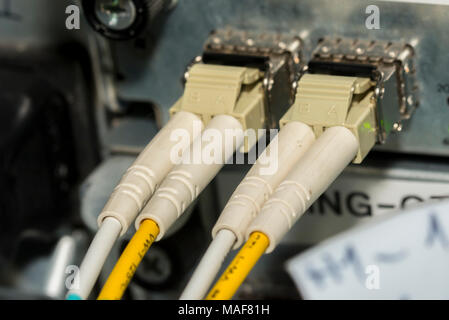 Network cables and servers in a technology data center Network cables in switch Stock Photo