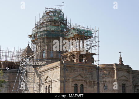 Echmiadzin (Etchmiadzin, Echmiatsin, Ejmiatsin) Cathedral under scaffolding during renovation, Vagharshapat, Armenia Stock Photo