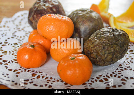 Clementine oranges and passion fruits as table centerpiece Stock Photo
