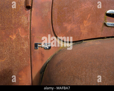 A chromed "F-5" logo on old 1948 Ford F-5 F5 truck, in a stone quarry, east of Clark Fork Idaho. Stock Photo