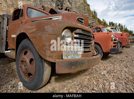 An old 1948 Ford F-5 F5 flatbed, stake body truck, in a stone quarry, east of Clark Fork Idaho. Stock Photo
