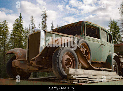 A green 1932 Chevrolet Series BA Confederate four door sedan in an old stone quarry, east of Clark Fork, Idaho. Stock Photo