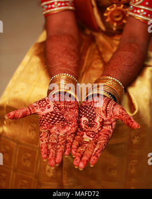 Hands painted with henna close up, Indian wedding ceremony Stock Photo
