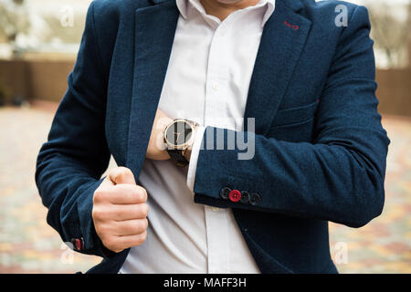 Elegant man in blue suit, business man's hand with fashion no brand wrist watch, men fashion and accessories closeup shot Stock Photo
