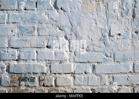 Old brick wall whitewashed with lime Stock Photo