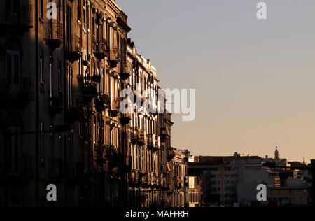 Buildings shine golden during a sunset in Lisbon, Portugal Stock Photo