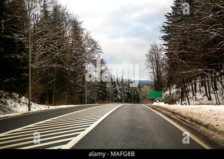 Curved Two Lane Country Road Winding Through Trees Stock Photo