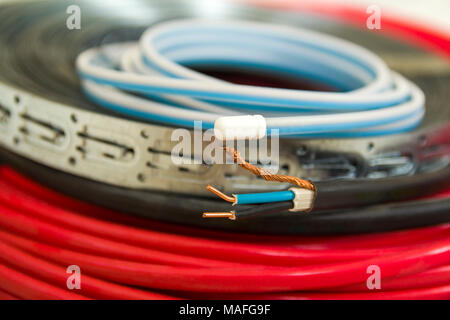 Heating floor system wires and cables. Renovation and construction concept. Comfort house. Stock Photo