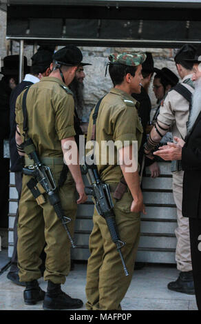 Israeli defense force soldiers holding a chat in a break from work at gaza border Stock Photo