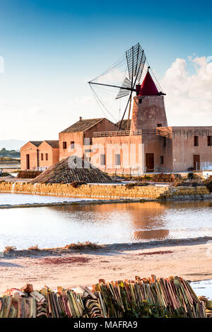 Marsala, Italy. Stagnone Saline Lagoon with vintage windmills and saltwork, Trapani province, Sicily. Stock Photo