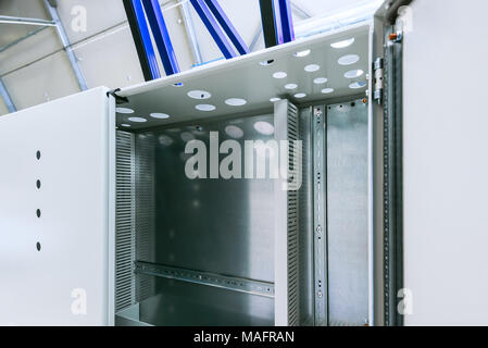 Industrial enclosure cabinet for electrical equipment with lamp and cooling unit. Stock Photo
