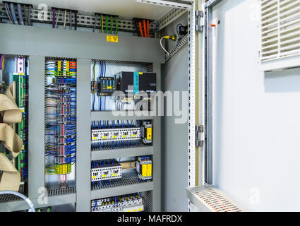 Automatic fuse electrical connector in power lines. Industrial electric enclosure, switch control panel board. Stock Photo