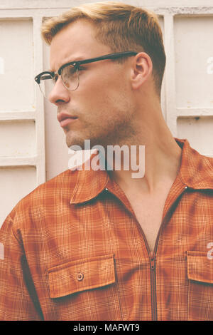 A Caucasian man, male model posing wearing men's 70s vintage shirt, a men's vintage fashion editorial concept. Stock Photo