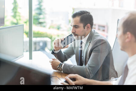 Business team analyzing data at business meeting. Stock Photo