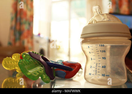 empti baby bottle colorfull background Stock Photo