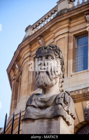 Grotesque roman style bust at the Sheldonian Theatre, Oxford University, Oxford, Oxfordshire, South East England, UK Stock Photo