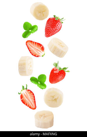 Isolated flying fruits. Falling banana and strawberry isolated on white background with clipping path as a packaging design and advertising. Stock Photo