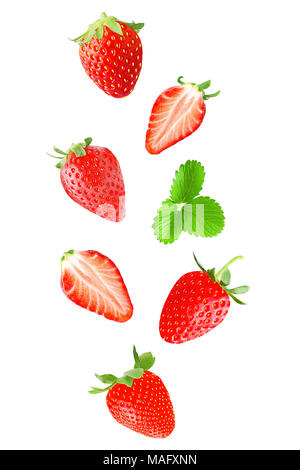 Isolated falling fruits. Falling strawberry fruit isolated on white background with clipping path as package design element. Stock Photo