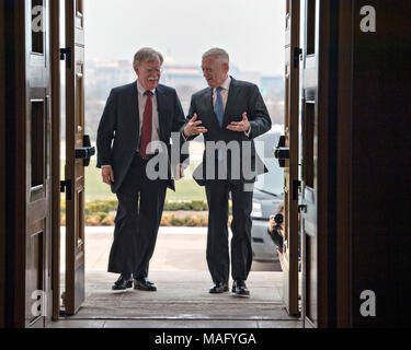 U.S. Secretary of Defense James Mattis, right, escorts the newly appointed National Security Advisor John Bolton on arrival at the Pentagon March 29, 2018 in Arlington, Virginia. Stock Photo