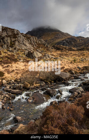 Tryfan mountain with cloud and stream, Snowdonia, North Wales Stock Photo