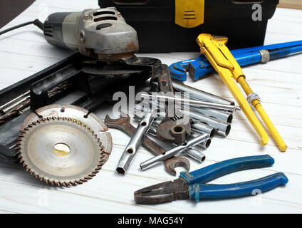 Collection of old tools for repair of household equipment and sanitary ware. Stock Photo