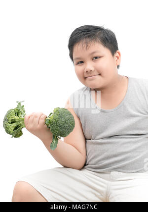 Obese fat boy holding a broccoli dumbbell isolated on white background, diet and exercise for good health concept Stock Photo