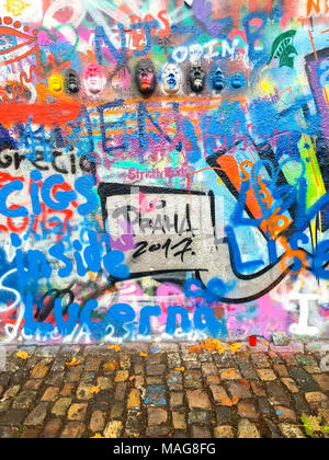 John Lennon tribute wall in Prague city center, covered with colorful graffiti and paintings by common people Stock Photo