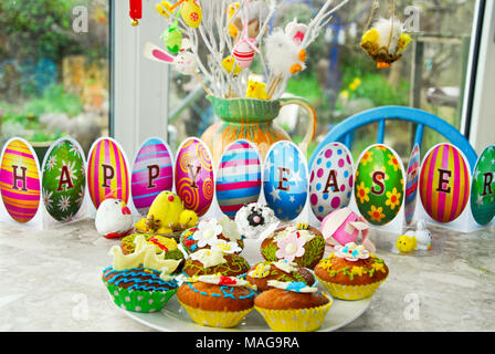 Portland, UK. 1st April 2018 - Student, Sophie (22), has fun baking tasty Easter treats on cold, rainy Sunday on the Isle of Portland in Dorset Stock Photo