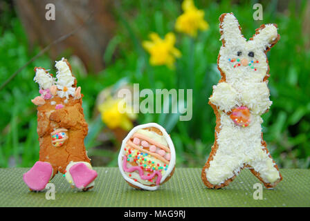 Portland, UK. 1st April 2018 - Student, Sophie (22), has fun baking tasty treats  - 'Snowy and 'Rapper' bunny with their own egg, in Sophie's Portland garden Stock Photo