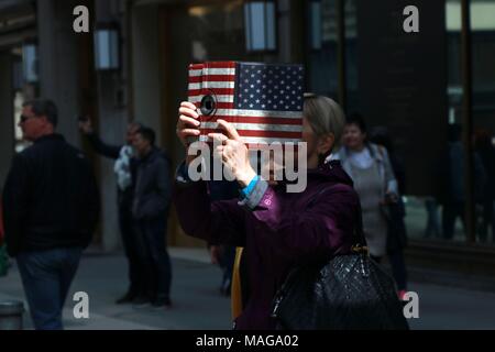 New York, USA. 01st Apr, 2018. New York, NY US. 1st. Apr, 2018. The annual holiday parade attracted a large crowd of all ages and from around the world featuring revelers dressed in colorful outfits, bunny ears and - the always anticipated - creative hats and bonnets. The Easter parade and bonnet festival was made famous by Irving Berlin's song, 'Easter Parade,' in 1933. The song was later featured in the film 'Easter Parade' starring Judy Garland and Fred Astaire. © 2018 Credit: G. Ronald Lopez/Alamy Live News Stock Photo