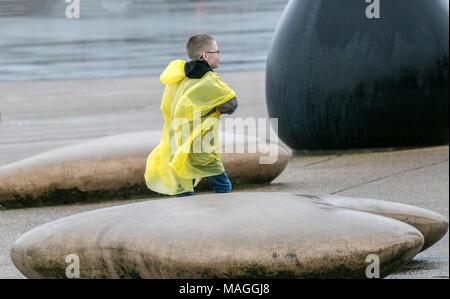 Blackpool. 2nd April 2018. UK Weather.  Dreadful Bank Holiday Weather, Terrible windy and rainy weather conditions batter the north west seafront at the seaside coastal resort town of Blackpool in Lancashire.  Closed ice cream kiosks and deserted beaches due to the severe weather as tourists head home early over the Easter bank holiday weekend. Credit: Cernan Elias/Alamy Live News Stock Photo