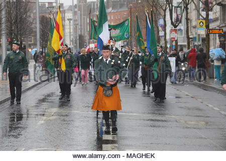 Dublin, Ireland. April 2, 2018. A Republican march passes through O'Connell Street in Dublin this lunchtime in honour of the 1916 Rising against the British government. In heavy rain a piper lead the participants to the GPO and on to Arbour Hill cemetery. Credit: reallifephotos/Alamy Live News Credit: reallifephotos/Alamy Live News Stock Photo