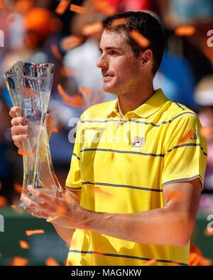 April 01, 2018: John Isner of the United States holds his championship trophy after defeating Alexander Zverev of Germany in the men's single final at the 2018 Miami Open presented by Itau professional tennis tournament, played at the Crandon Park Tennis Center in Key Biscayne, Florida, USA. Isner won 6-7(4), 6-4, 6-4. Mario Houben/CSM. Stock Photo
