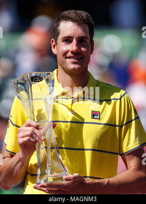 April 01, 2018: John Isner of the United States poses with his championship trophy after defeating Alexander Zverev of Germany in the men's single final at the 2018 Miami Open presented by Itau professional tennis tournament, played at the Crandon Park Tennis Center in Key Biscayne, Florida, USA. Isner won 6-7(4), 6-4, 6-4. Mario Houben/CSM. Stock Photo