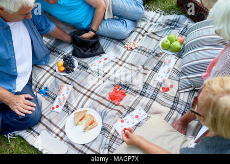 Seniors Playing Lotto in Park Stock Photo