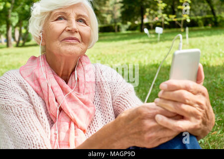 Senior Woman Using Smartphone Stock Photo