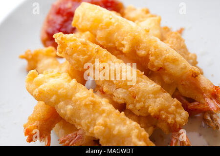 Prawns cooked in batter with a sweet chilli sauce Stock Photo