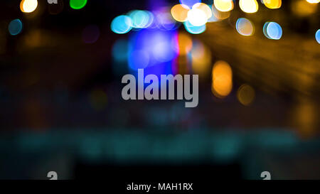 Out of focus background with blurry unfocused lights. Video. Color Blurred background : Bokeh lighting in city night light blur bokeh. Floodlights. Concert stage flash lights. Stock Photo